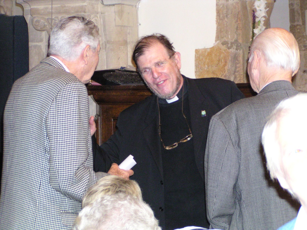 Rev Daniel Foote greets X and Lloyd at St James prior to service.JPG