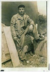 Msgt. Kishel in front of his work shop and line tent.jpg