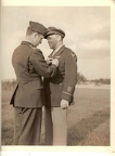 LTC William E. Buck presents a medal to William E.  Dolan