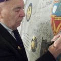 Adding his signature to the Commemorative Wing Panel
