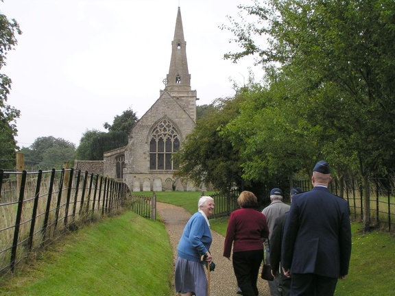 Nancy Braines greets us on our way to services at St James in Grafton Underwood.JPG