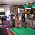 View past the bar and into the dining area in the Chequers.JPG