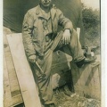 Msgt. Kishel in front of his work shop and line tent.jpg
