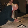 Gene Goodrick signing the wing panel.