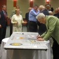 Gene Voiland signing the wing panel.