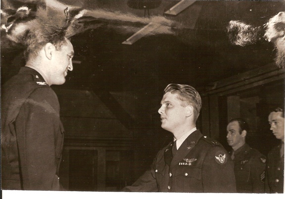 Lt Siguard Thompson receiving the air medal from COL Smith