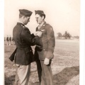 S/SGT Thomas P. Philbin receiving the Distinguished Flying Cross from LTC William E. Buck.