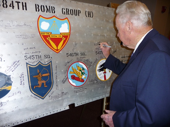 Bill O'Leary signing the wing panel.
