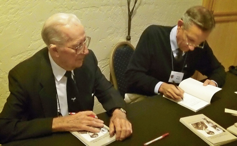 Jack Goetz and Jerry Meehl signing Jack's book.JPG