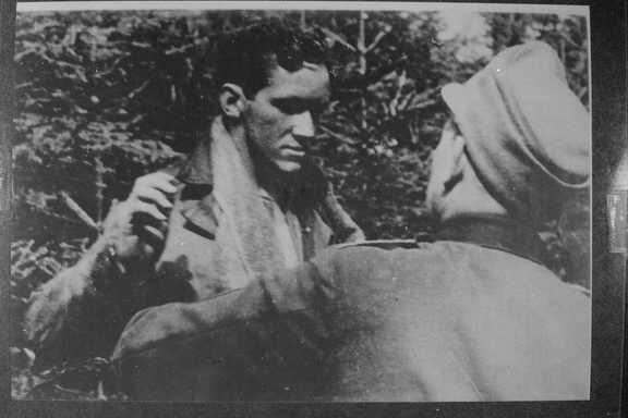 Airman getting frisked by German soldier