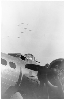 B17 on ground with formation in sky