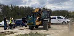 Telehandler moves bag of building sand
