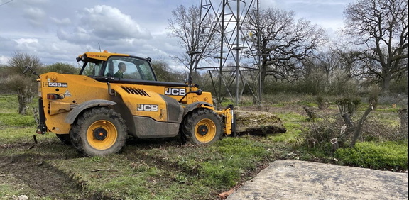 Telehandler moves old flagpole base, (well, the broken bit)