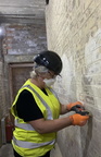 Helen hard at a thankless task.. Clearing lime wash paint off.